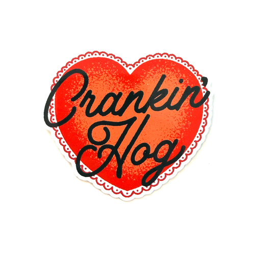 Red heart sticker with black hand-drawn script typography reading “Crankin' Hog” in a clean, minimalist style.