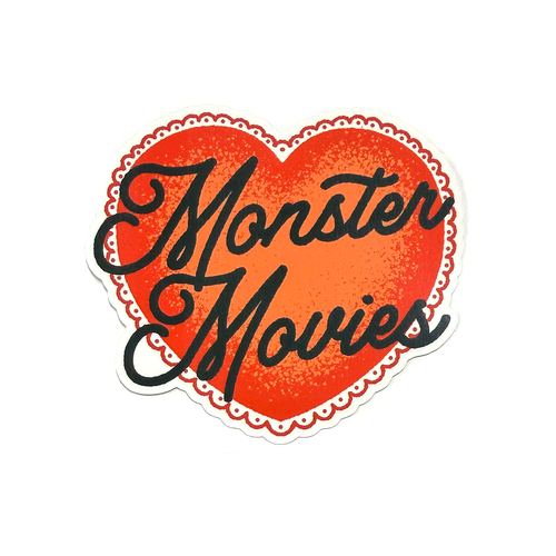 Red heart sticker with black hand-drawn script typography reading “Monster Movies” in a clean, minimalist horror-inspired style.