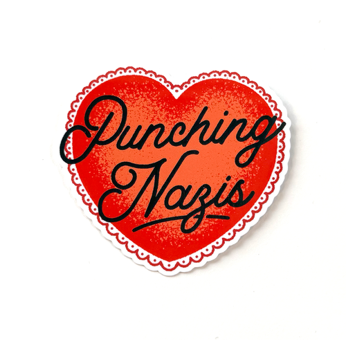 Red heart sticker with black hand-drawn script typography reading “Punching Nazis” in a clean, minimalist political style.